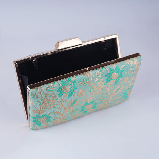 Elegant Banarasi jacquard clutch with traditional Indian motifs, perfect for pairing with sarees, lehengas, and festive attire