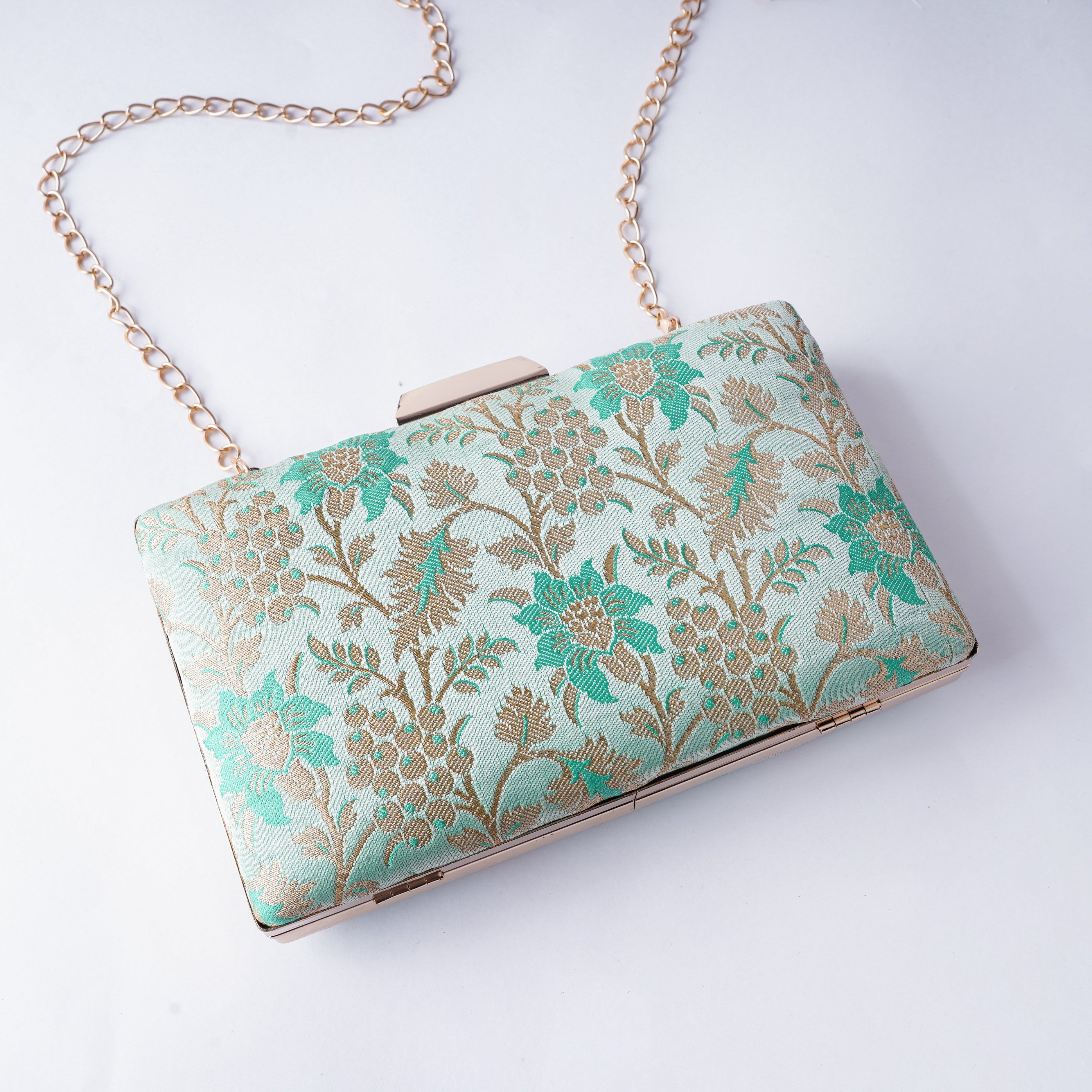 Classic Banarasi weave clutch with rich textures and intricate detailing, handcrafted for weddings, festivals, and cultural occasions