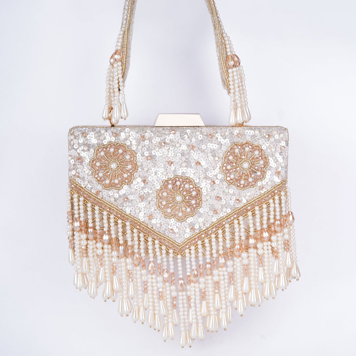 Elegant Meena work clutch featuring sequin and bead detailing, handcrafted handle, tassels, and detachable chain – ideal for weddings and cocktail events