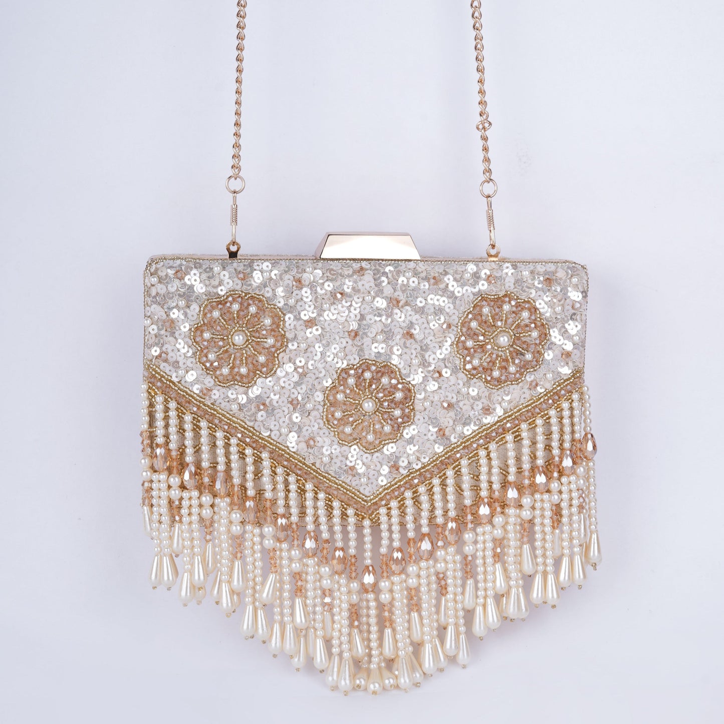 Elegant sequin clutch with intricate beadwork and playful drop tassels, designed for festive occasions and available in four shades