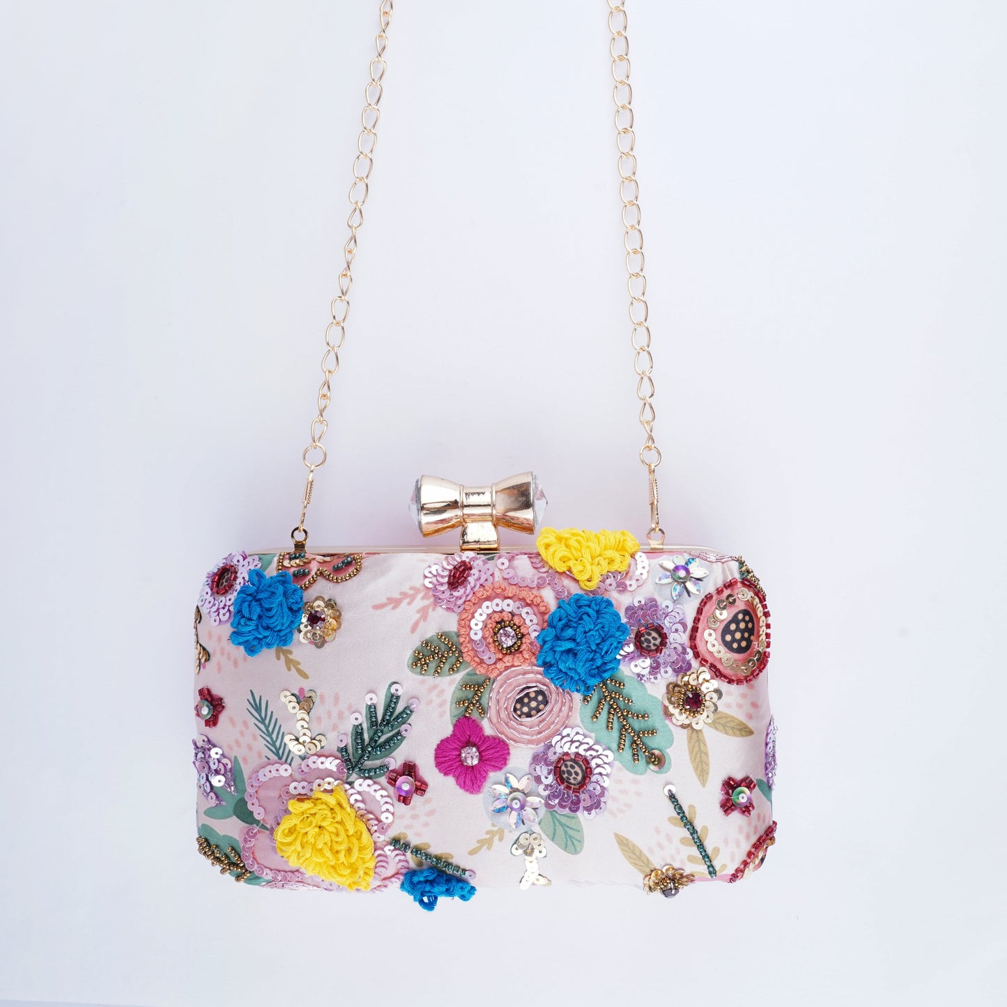 Unique multicolor printed clutch with contrasting embroidery, a handcrafted statement accessory for any festive look