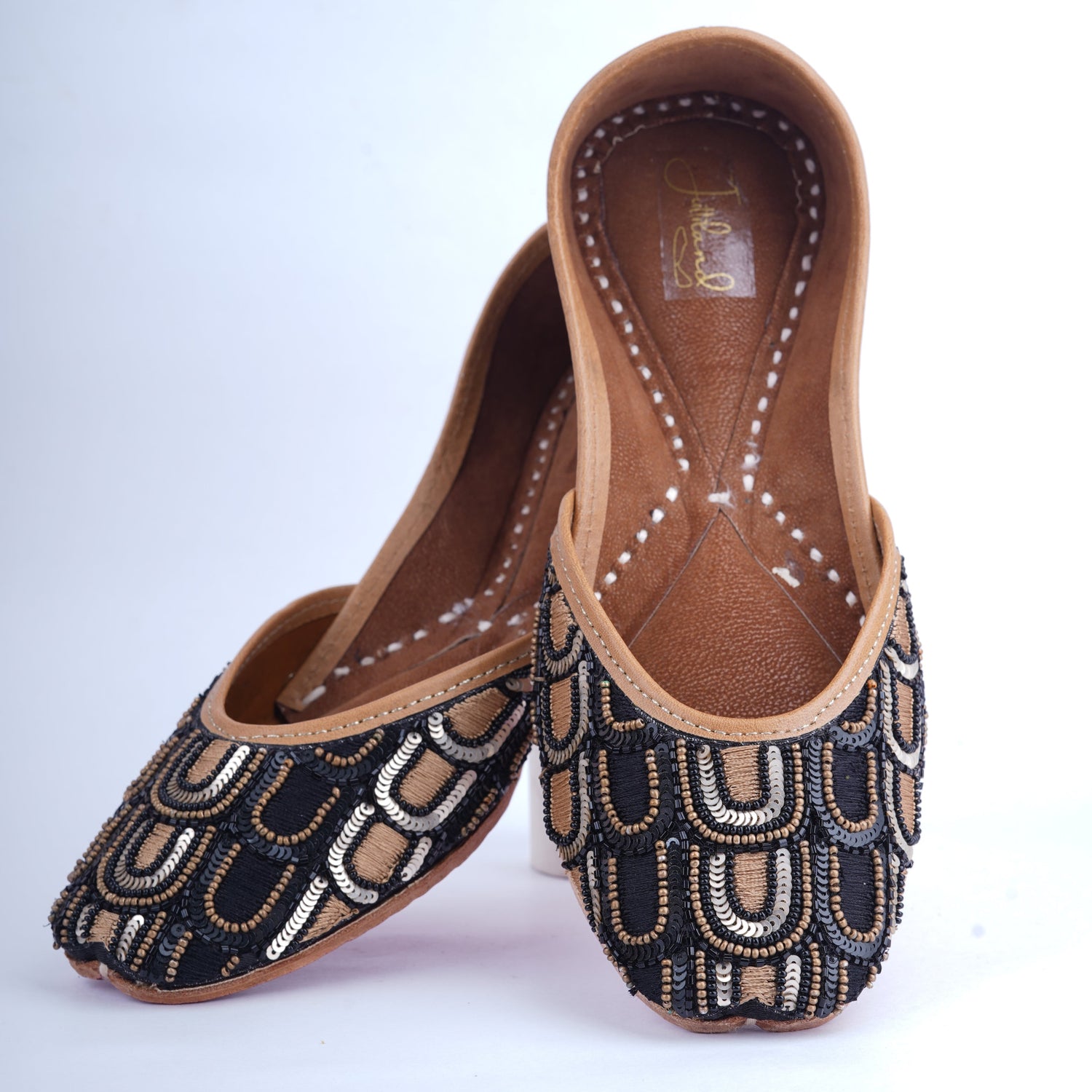 Black and golden jutti for women with traditional embroidery
