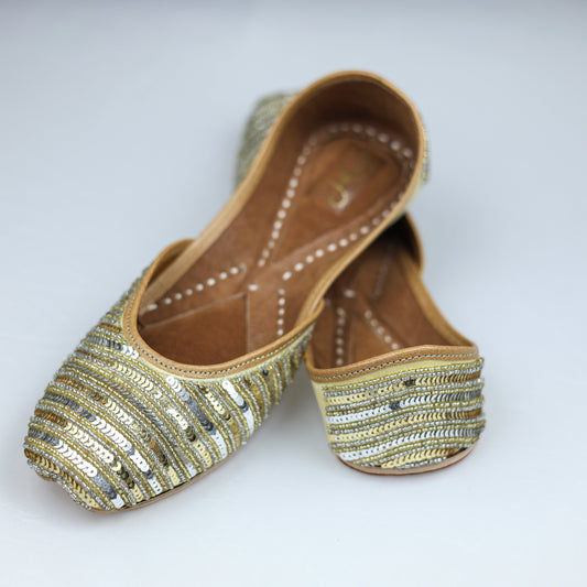 Traditional Punjabi-style gold jutti with sequin work for brides and weddings