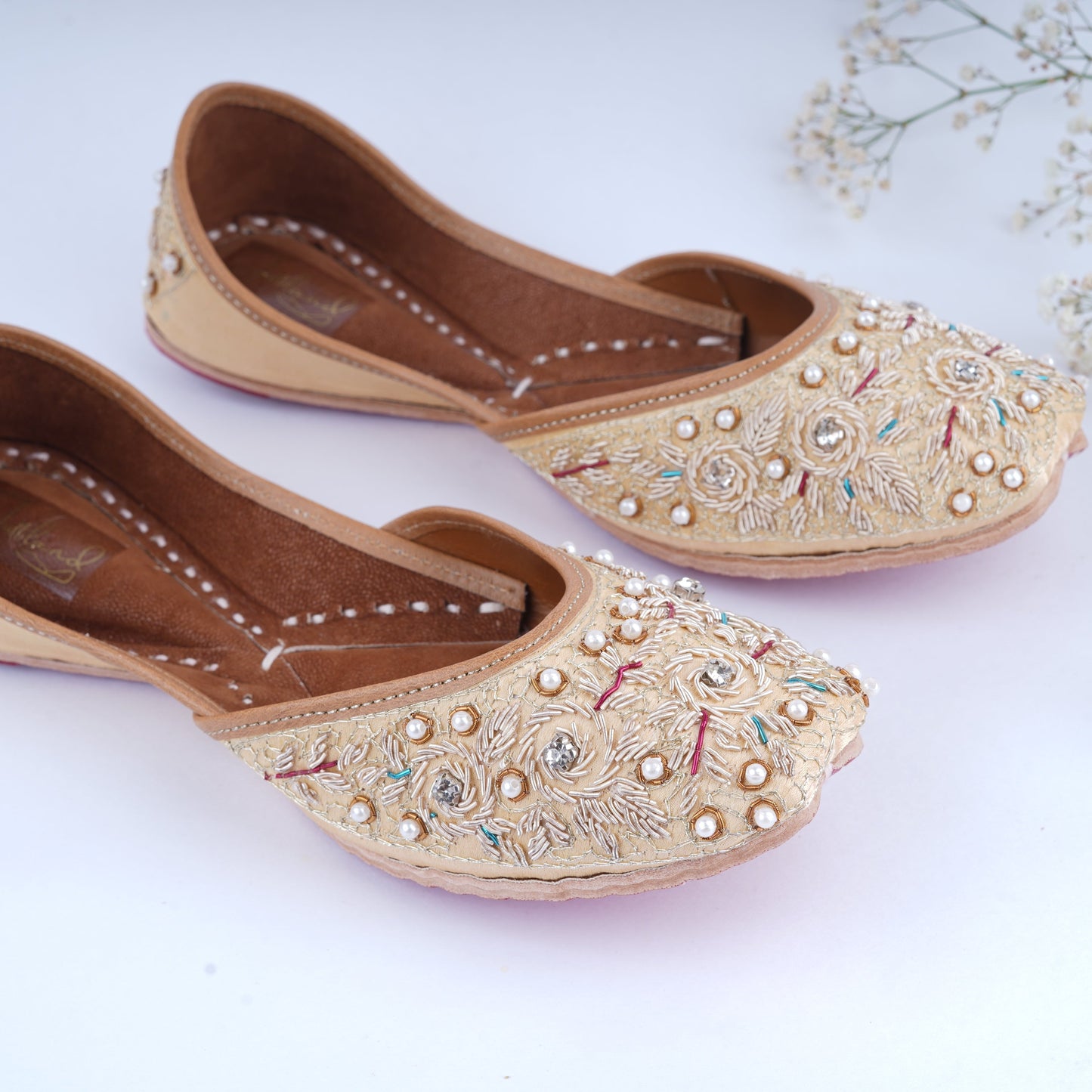 Bridal golden jutti with hand embroidery for wedding outfit