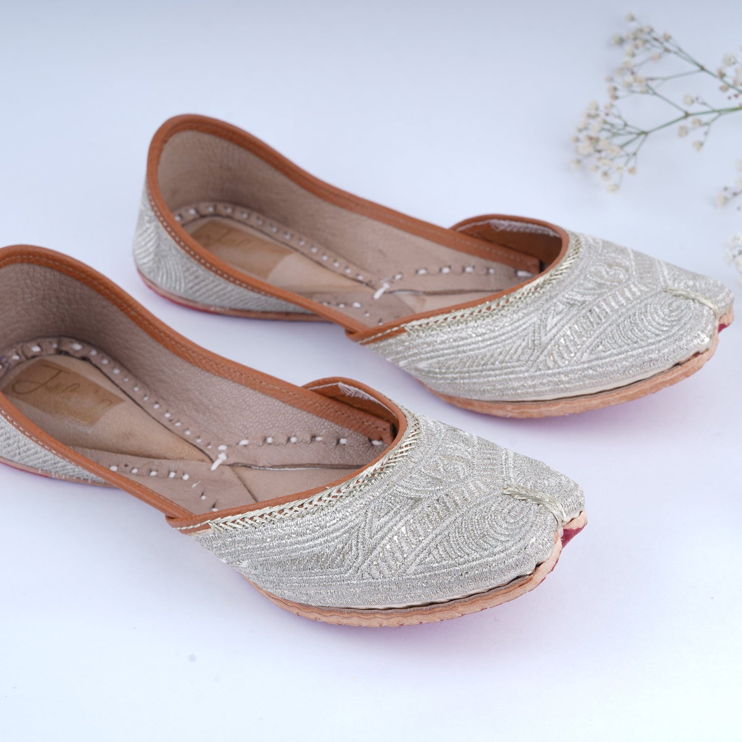 Ethnic golden jutti with intricate zari detailing for women