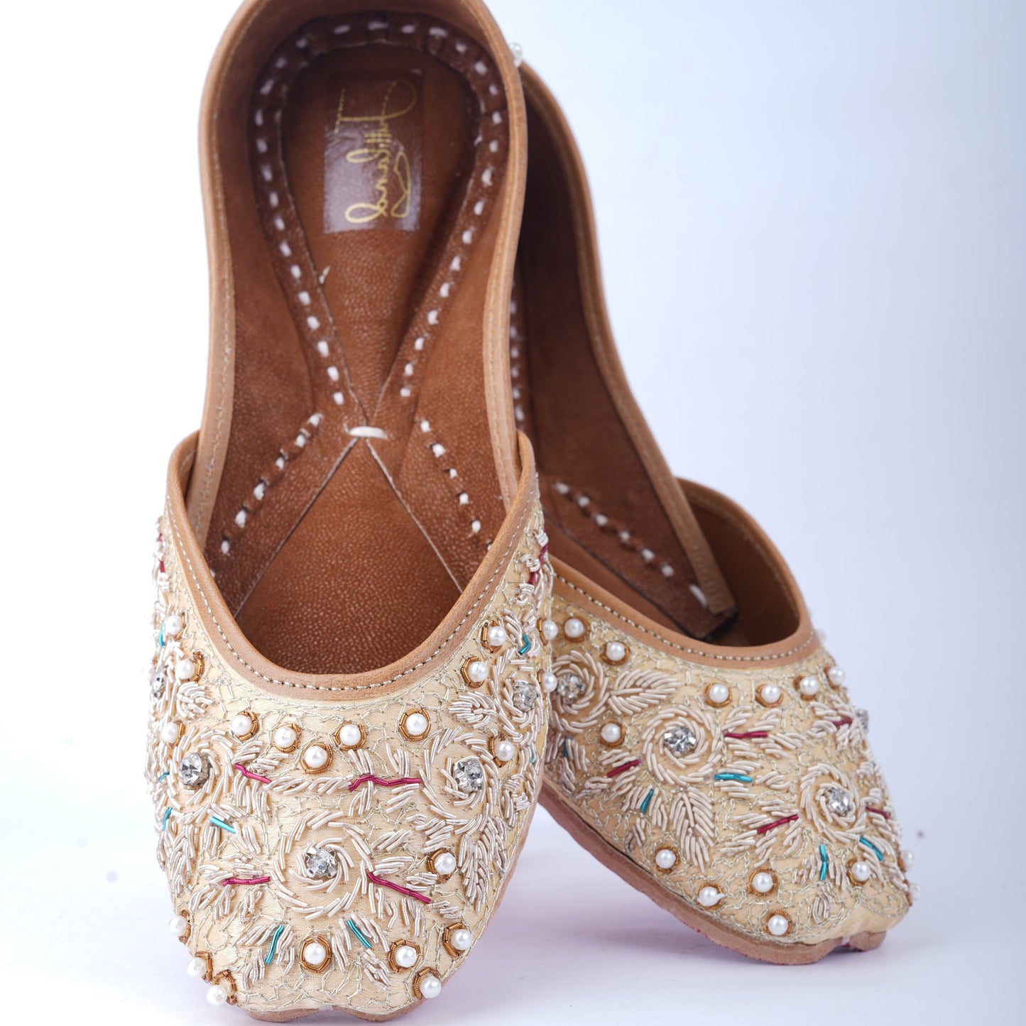 Golden jutti for women with traditional embroidery