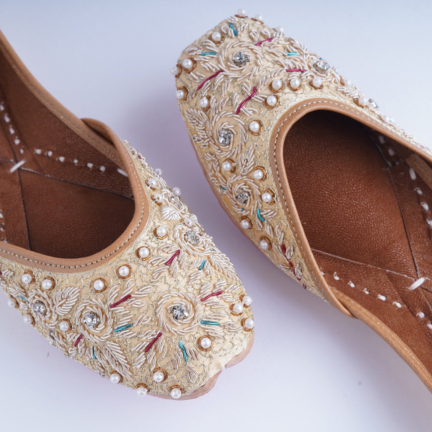 Designer golden jutti with detailed handcrafted work