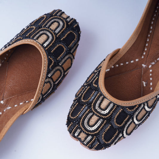 Party wear jutti in black and gold for festive outfits