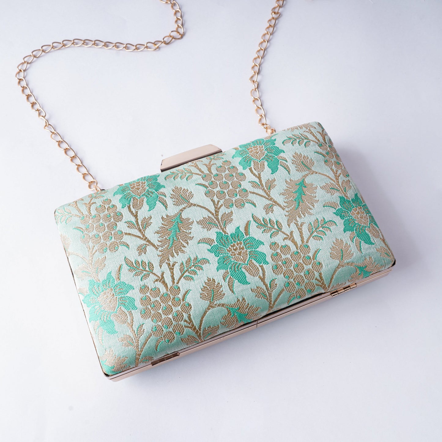 Classic Banarasi weave clutch with rich textures and intricate detailing, handcrafted for weddings, festivals, and cultural occasions

