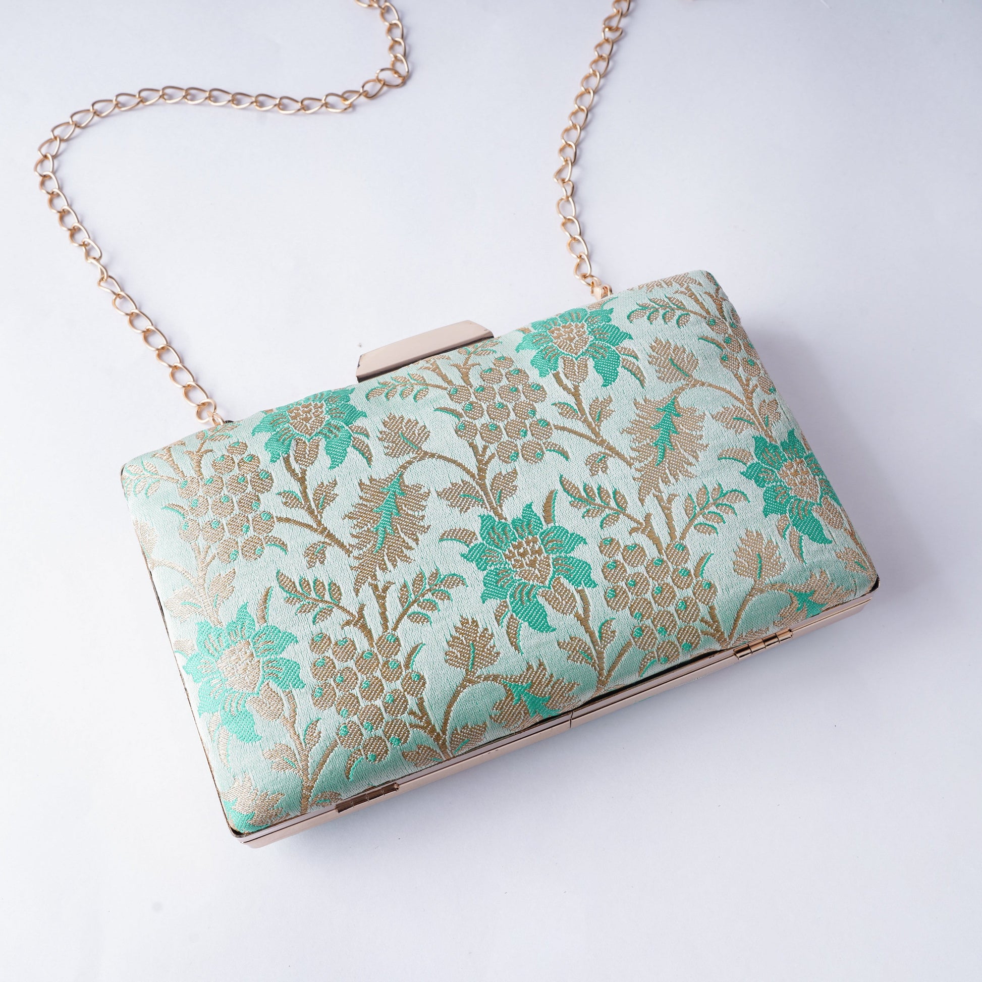Classic Banarasi weave clutch with rich textures and intricate detailing, handcrafted for weddings, festivals, and cultural occasions

