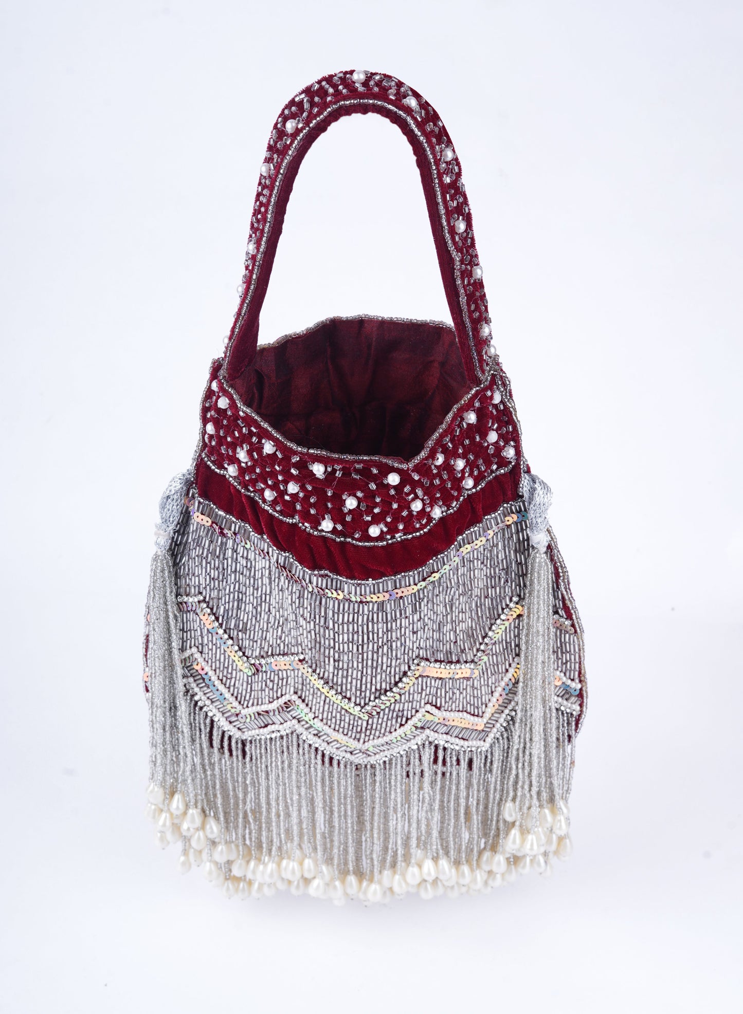Handmade traditional potli clutch with all-over pearl embellishments, perfect for bridal looks and festive wear