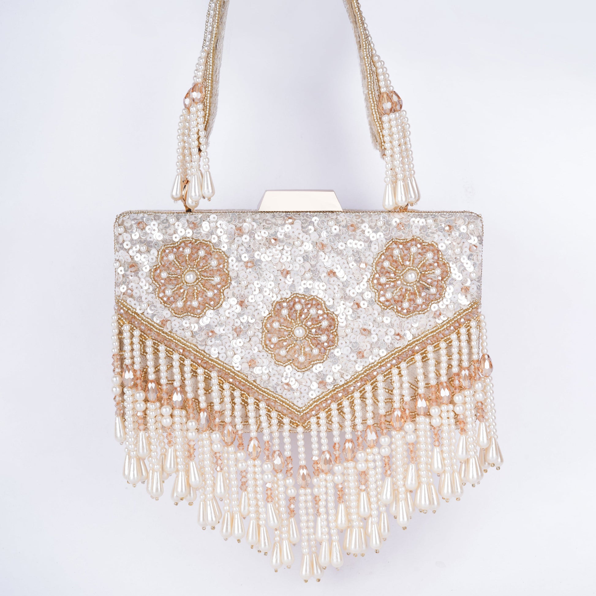 Elegant Meena work clutch featuring sequin and bead detailing, handcrafted handle, tassels, and detachable chain – ideal for weddings and cocktail events