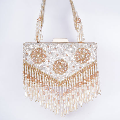 Elegant Meena work clutch featuring sequin and bead detailing, handcrafted handle, tassels, and detachable chain – ideal for weddings and cocktail events