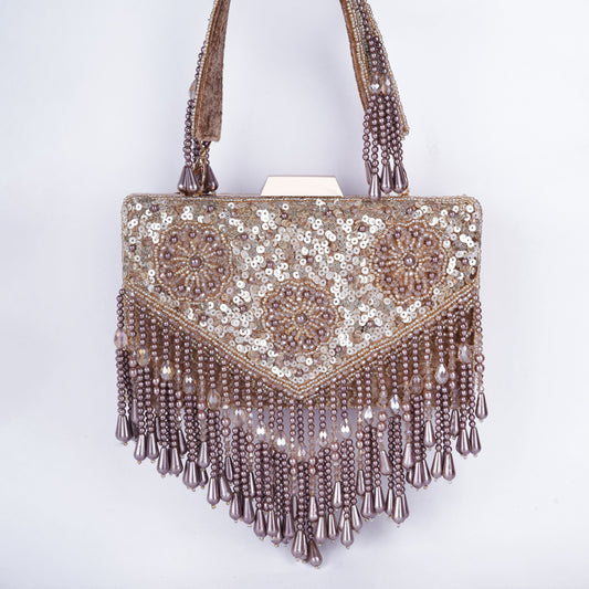 Rectangular clutch with intricate Meena work, sequin and bead embellishments, handcrafted handle, and tassels – available in black, golden, antique, and silver