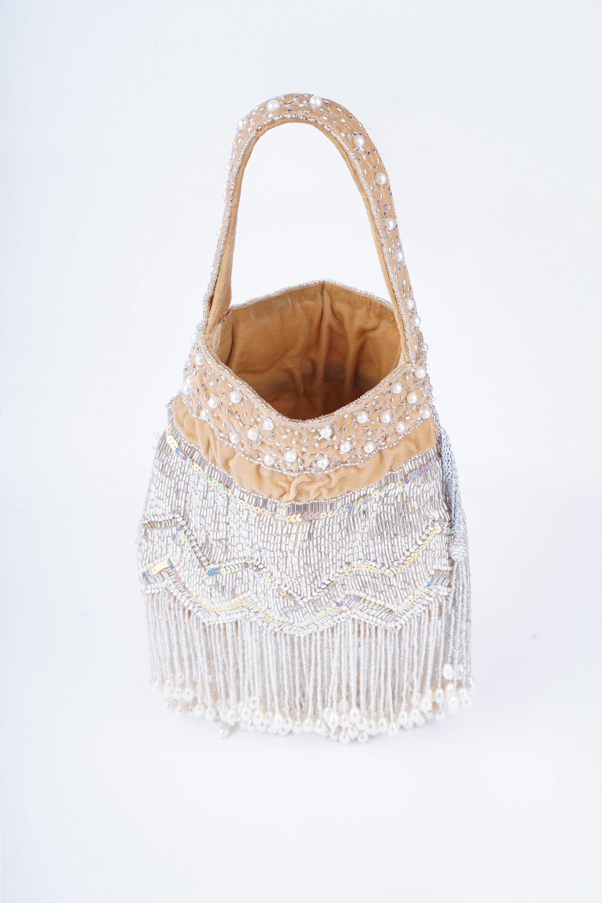 Elegant handcrafted potli bag with intricate pearl embellishments, perfect for weddings and traditional occasions

