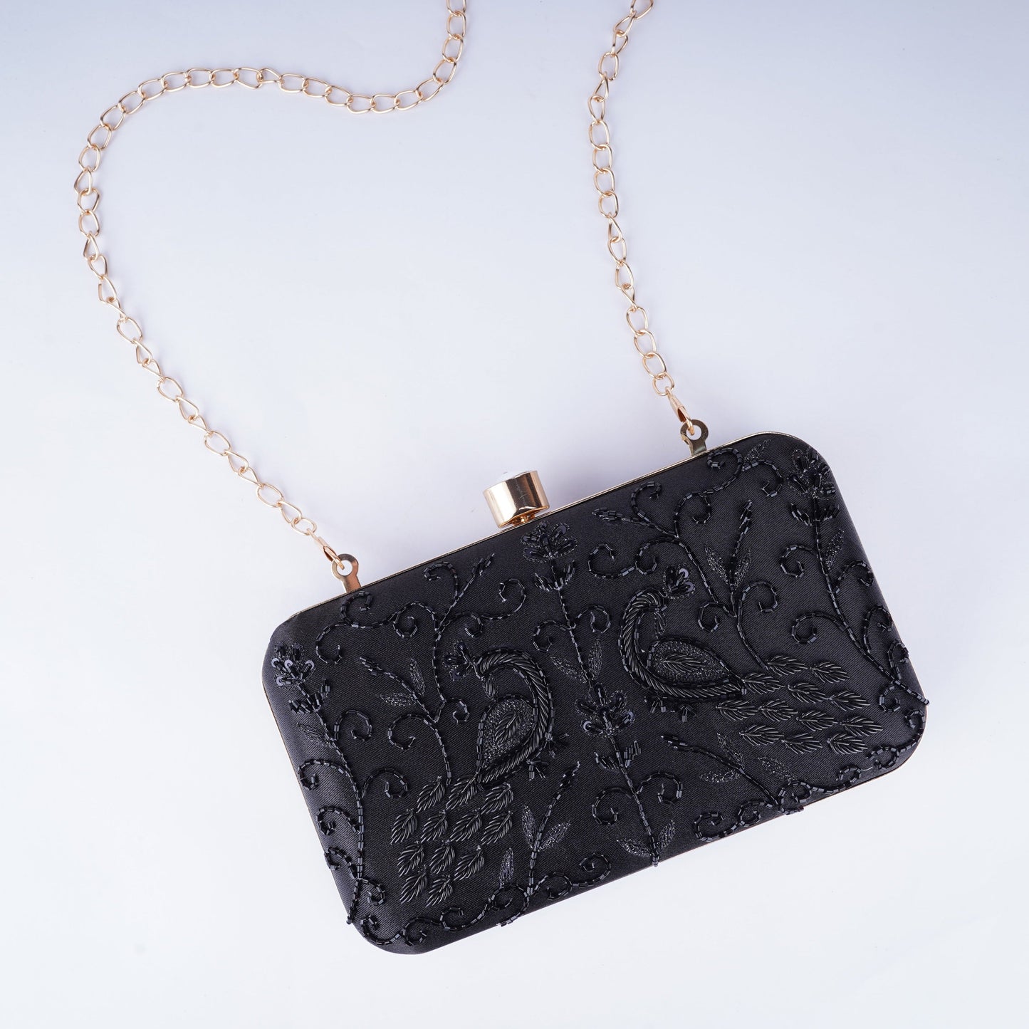 Statement black embellished evening clutch handcrafted in a sleek rectangle design, adds luxury to any outfit