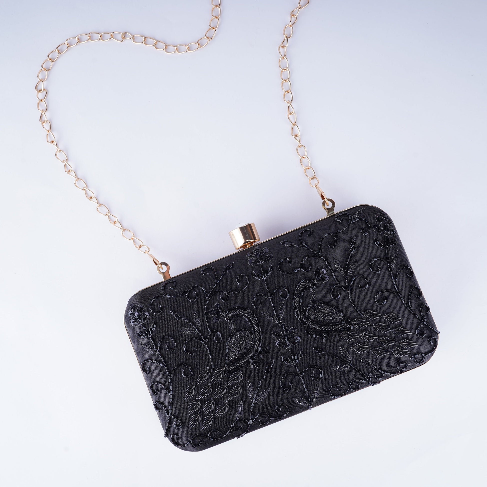 Statement black embellished evening clutch handcrafted in a sleek rectangle design, adds luxury to any outfit