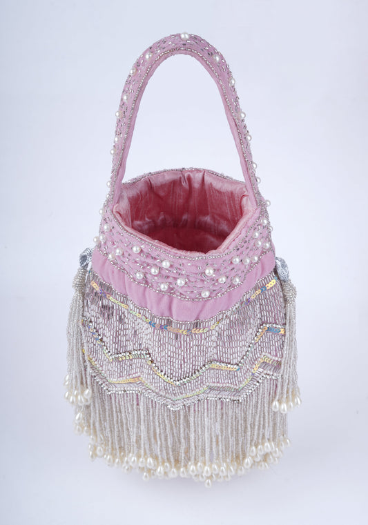 Designer potli bag adorned with delicate white pearl work, ideal for pairing with ethnic and bridal outfits