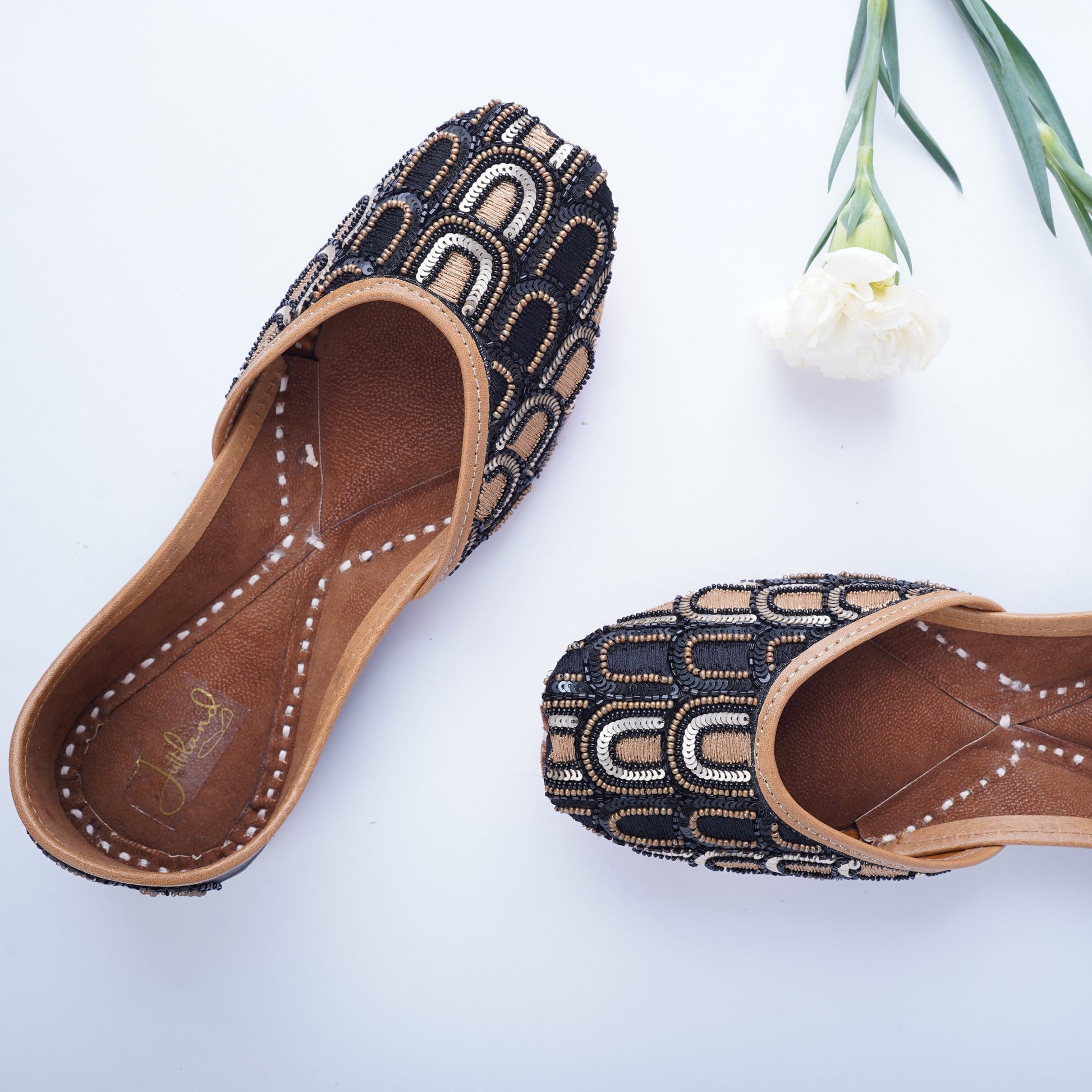 Designer black golden jutti for weddings and functions