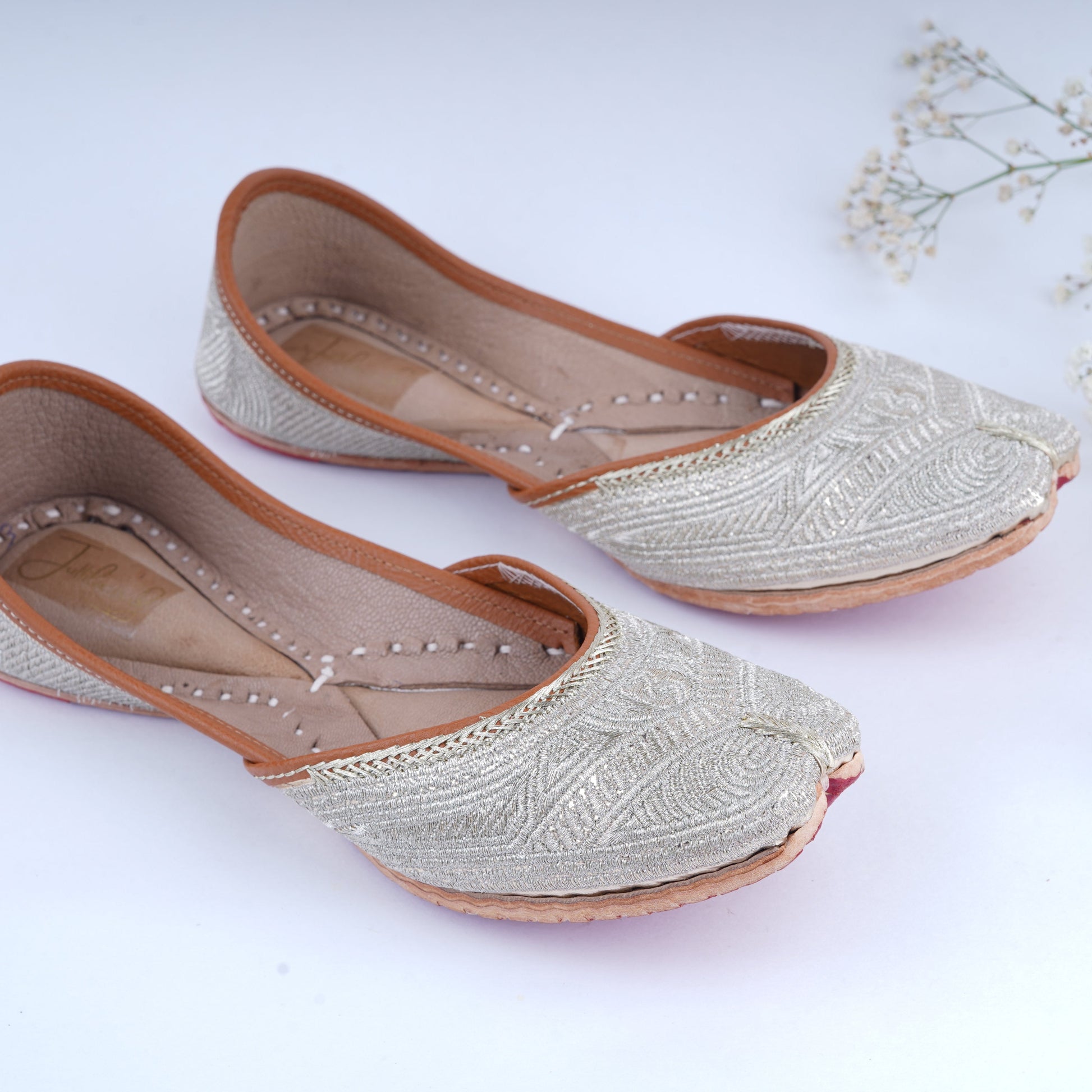 Ethnic golden jutti with intricate zari detailing for women