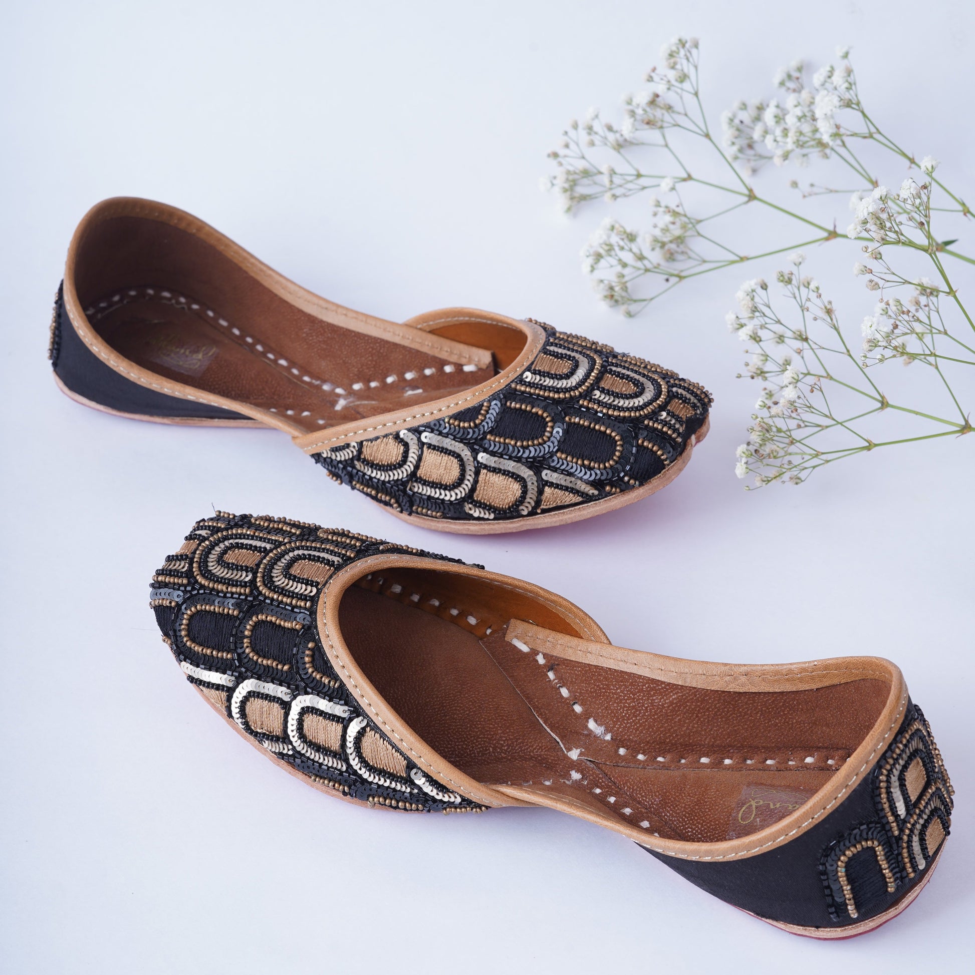 Ethnic jutti with black base and golden handwork