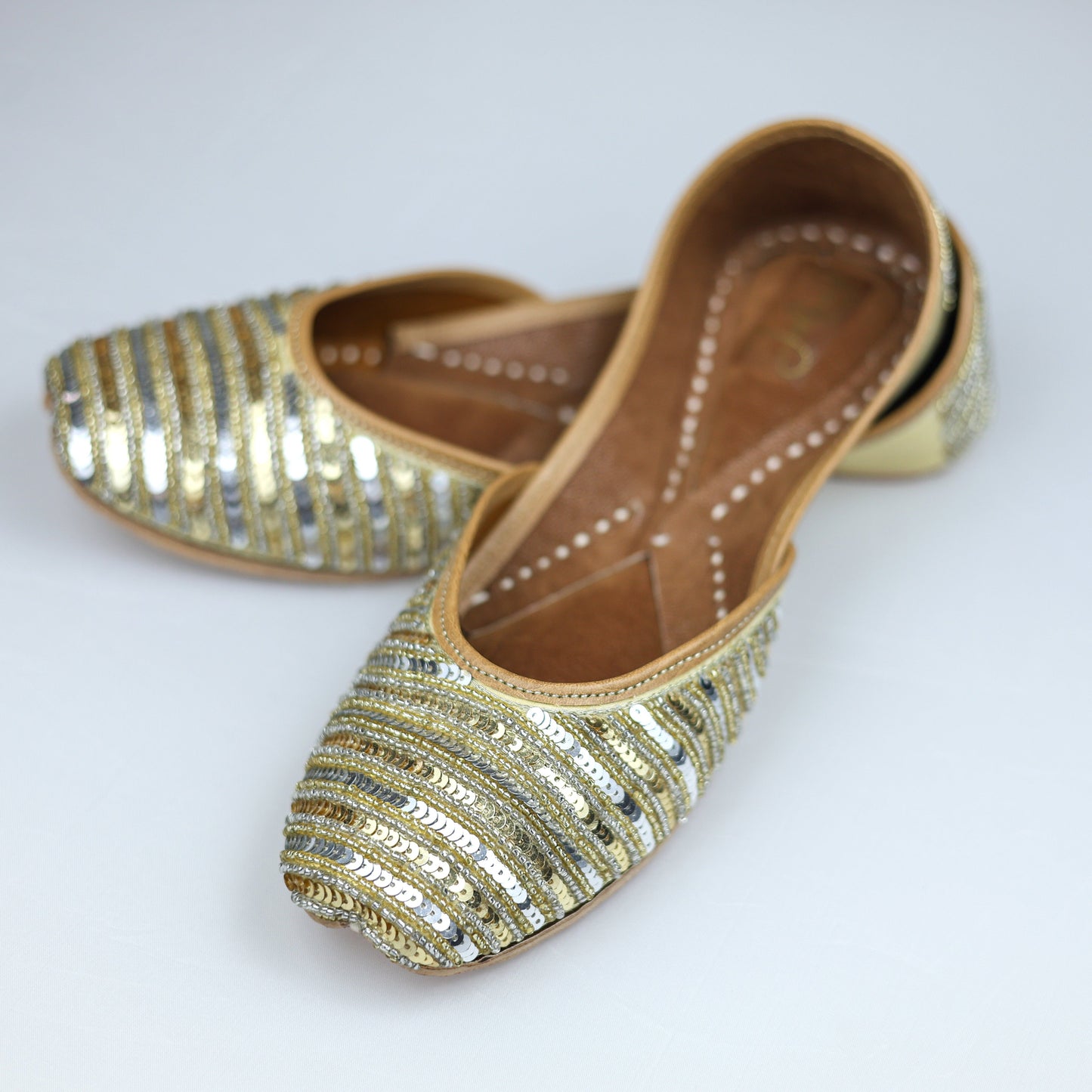 Gold and silver handcrafted jutti for women – perfect for ethnic and festive wear