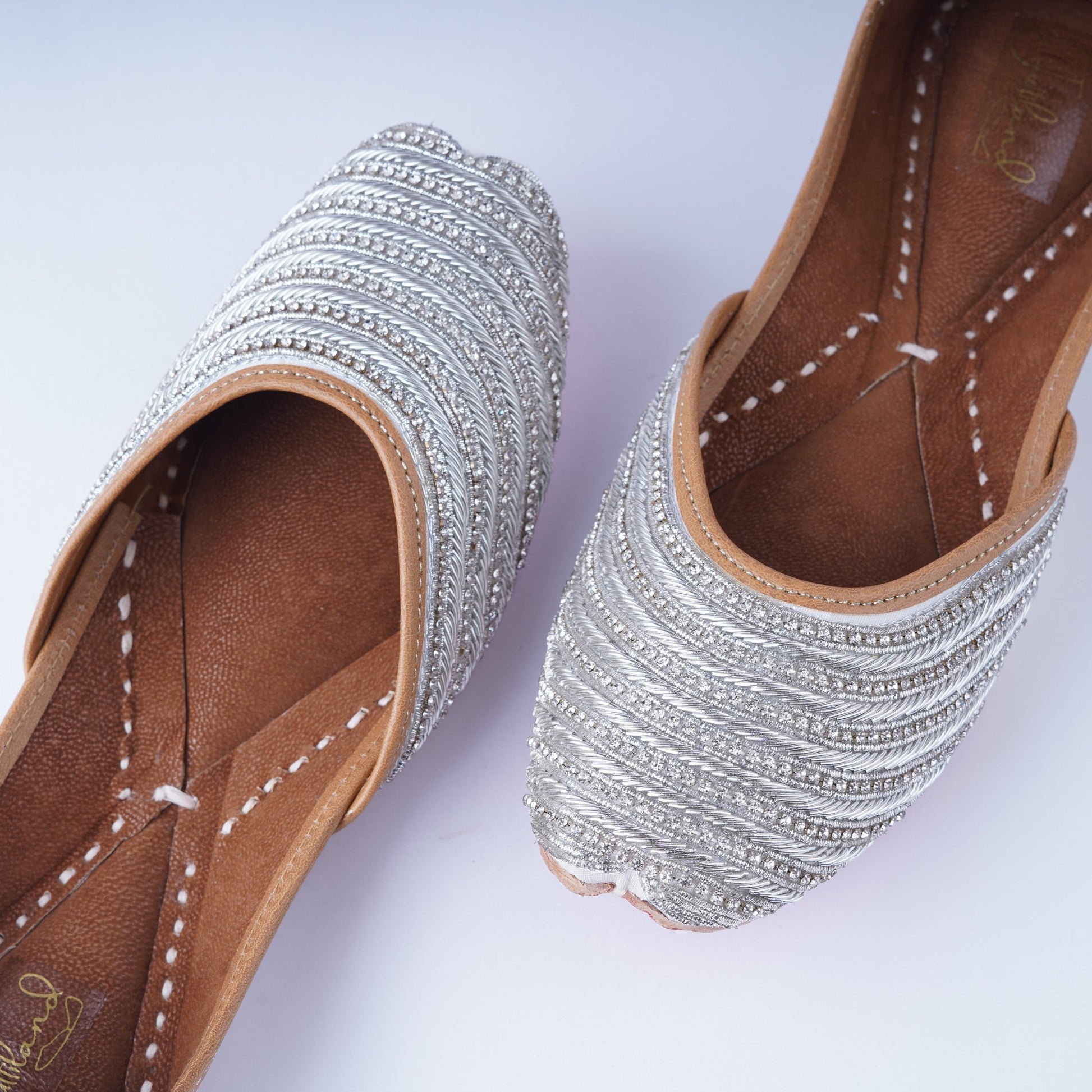 Handcrafted designer silver jutti with detailed embellishments – elegant and comfortable